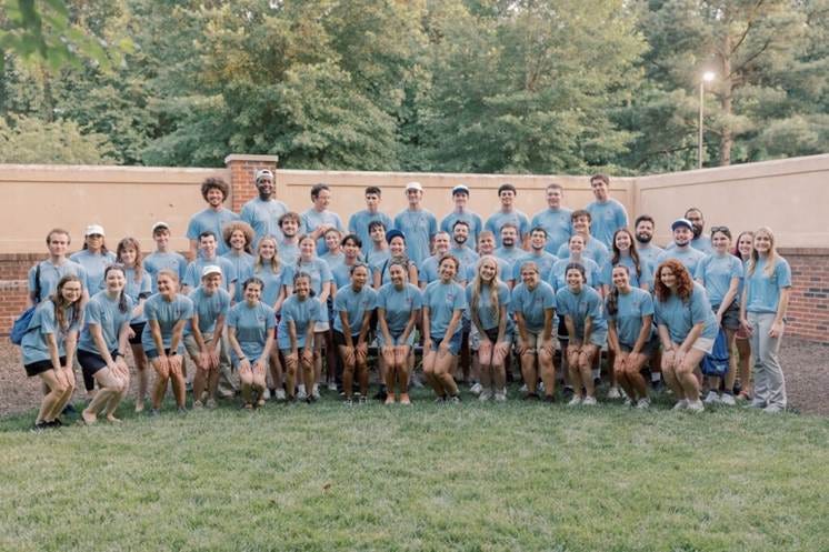 A group of people posing for a photo AI-generated content may be incorrect. A group of people posing for a photo AI-generated content may be incorrect.