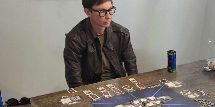 Image for article: Man Torn Between Learning New Board Game Or Getting PhD In Quantum Physics