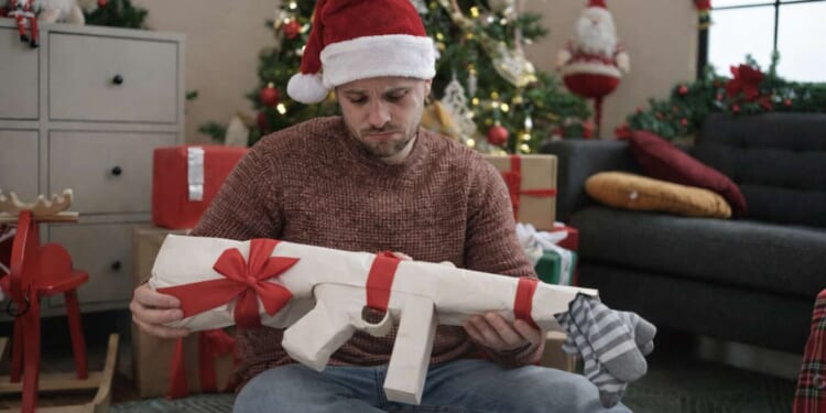 Image for article: Dad Disappointed As Thompson Submachine Gun-Shaped Box Turns Out To Be Socks