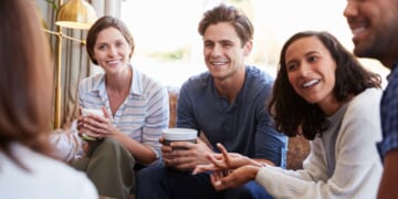 Image for article: Small Group Waits In Hushed Anticipation As Newlyweds Prepare To Offer Marriage Advice