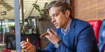 Image for article: Man Smokes Cigar In Desperate Hope To Feel Sick And Become Unattractive To Wife