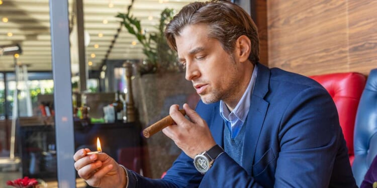 Image for article: Man Smokes Cigar In Desperate Hope To Feel Sick And Become Unattractive To Wife