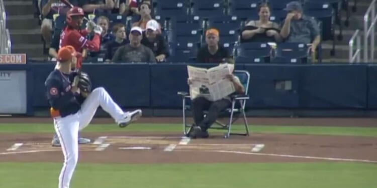 Image for article: CB Bucknor Calls Entire Game Without Once Looking Up From His Newspaper