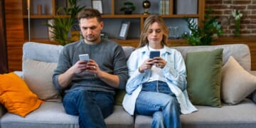 Image for article: Couple Worries Having A Baby Could Cut Into Time They Spend Sitting On The Couch Staring At Their Phones