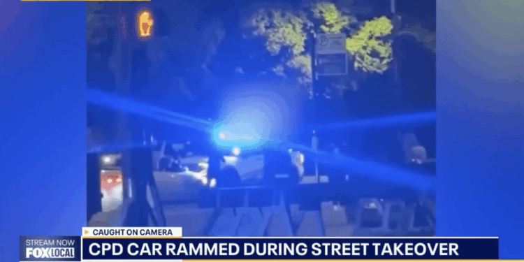 Chicago police cruiser rammed during teen street takeover as crowd cheers and records chaos