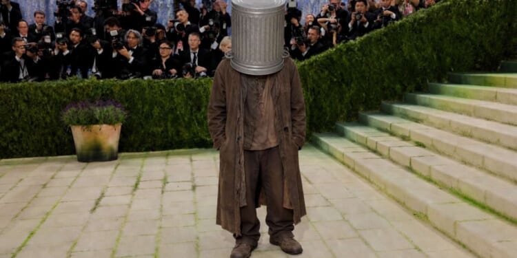 Image for article: Hobo With Garbage Can Stuck On His Head Mistaken For Met Gala Attendee