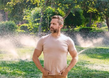 Image for article: Like Genghis Khan Gazing Over His Empire, Man Watches As Fixed Sprinkler No Longer Waters Driveway