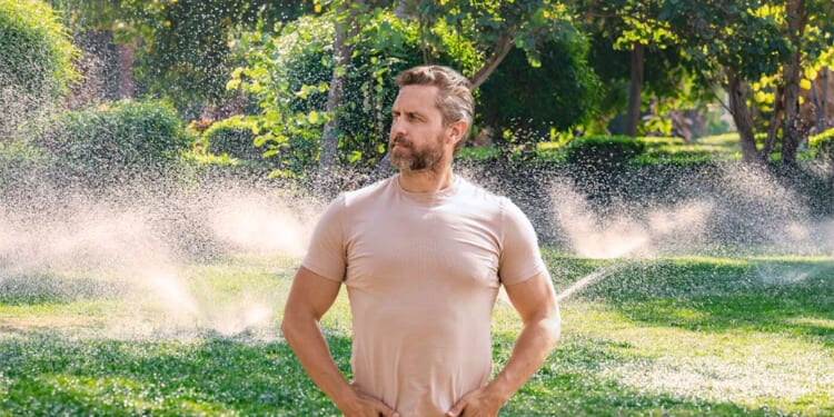 Image for article: Like Genghis Khan Gazing Over His Empire, Man Watches As Fixed Sprinkler No Longer Waters Driveway