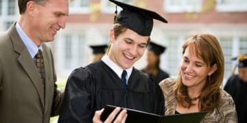 Image for article: Parents Help Graduate Sound Out The Words On Diploma