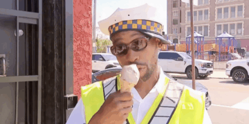 Philadelphia crossing guard goes viral after rescuing child from crash while calmly eating ice cream on TV
