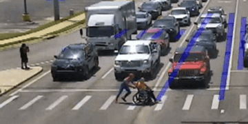 Arkansas Spider-Man Helps Wheelchair User Cross Road
