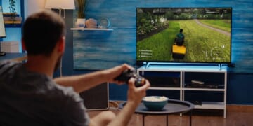 Image for article: Man Informs Wife He Can't Mow The Lawn Today As He Is Busy Playing Lawn Mowing Simulator