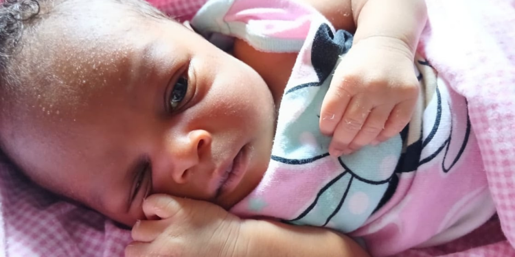 A mother holding her newborn baby
