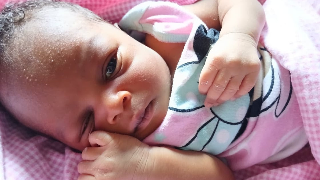 A mother holding her newborn baby