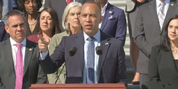 House Minority Leader Hakeem Jeffries giving a speech in front of Democratic members of Congress.